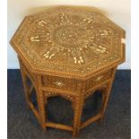 An Eastern ivory inlaid table decorated with flowe