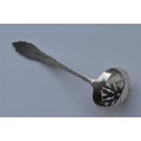 A small sifter spoon with embossed decoration. Bir
