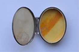 An unusual oval Continental box with MOP plaque. A
