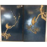 A pair of blue lacquered plaques decorated with bi