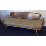 ERCOL: A spindle sided day bed with back support.