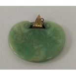 An Antique jade pendant of typical Oriental design