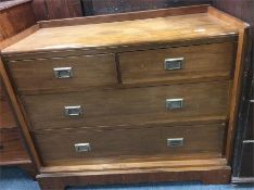 A mahogany four drawer travelling chest with brass