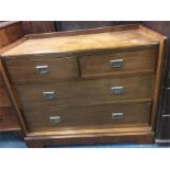 A mahogany four drawer travelling chest with brass