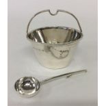A E JONES: An unusual cream pail with hammered bod