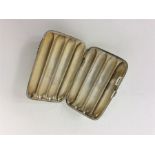 A good four finger cigar case with hinged side and