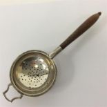 A small silver tea strainer on stand. London. by R