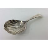 A fluted OE caddy spoon. London. By RC. Est. £30 -