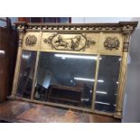 A large gilt overmantle mirror with fluted columns