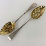 A pair of attractively decorated berry spoons with