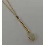 An opal and gold pendant in 15 carat on fine link