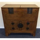 An early 20th Century hinged top chest with brass