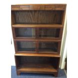 A stylish oak four stack bookcase with glazed door