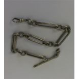 A heavy silver long and short link watch chain wit