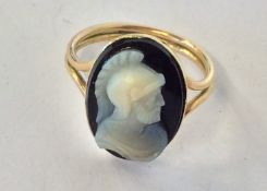A small oval hard stone cameo ring of a warrior in