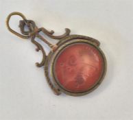 An Antique pierced spinning fob with cornelian int