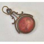 An Antique pierced spinning fob with cornelian int