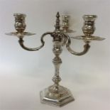 A large cast three light candelabra with lift-off