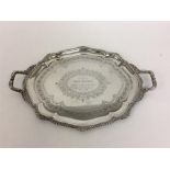 An attractive Edwardian silver tray with gadroon r