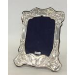 A large stylish modern silver picture frame decora