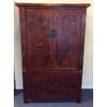 A 19th Century lacquered Shansi two door mid heigh