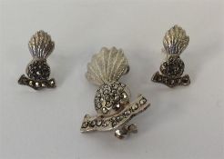 A silver and marcasite Military brooch together wi