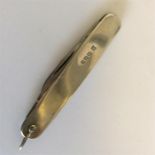 A small silver mounted pen knife with ring end. Sh