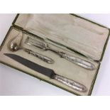 A cased French three piece carving set, the handle
