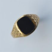 A 9 carat gypsy set ring inset with onyx. Approx.