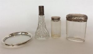 A group of silver mounted dressing table jars. Var