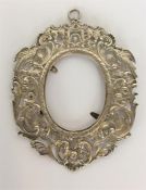A heavy Continental picture frame decorated with b