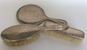 Three pieces of silver mounted dressing table item