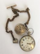 A small silver engine turned fob watch together wi