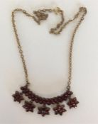 An Antique garnet mounted fringe necklace on suspe