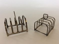 Two four division toast racks on bracket feet with