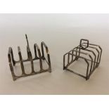 Two four division toast racks on bracket feet with