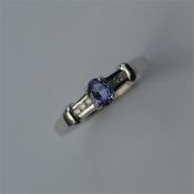 A good tanzanite and diamond ring in claw mount se