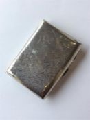 A silver engraved cigarette case decorated with sc