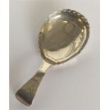 A Georgian caddy spoon attractively decorated with