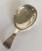 A Georgian caddy spoon attractively decorated with
