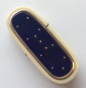 An oval Antique ivory box with gold mounts, blue p