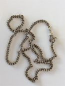 A heavy silver curb link watch chain with dog nose