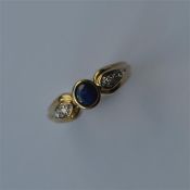 A sapphire and diamond ring in 9 carat mount. Appr