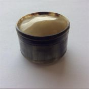 A small circular horn box with lift-off cover. Est