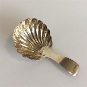A Georgian caddy spoon with fluted bowl. London 18