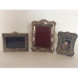 A group of three modern picture frames with emboss