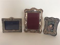 A group of three modern picture frames with emboss