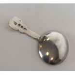 A Georgian caddy spoon with unusual tapered handle
