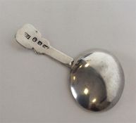 A Georgian caddy spoon with unusual tapered handle