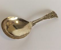 A Georgian Queens' pattern caddy spoon with plain